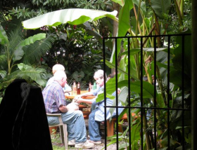 Linda Jensen dining in a patio with banana tree – Best Places In The World To Retire – International Living